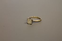 A 14ct gold solitaire diamond ring, the princess-cut stone weighing 1.