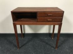 A late 20th century teak side table fitted two drawers