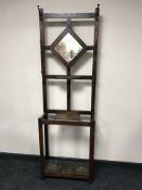 An oak mirrored hall stand