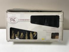 A boxed SAC traditional chess set