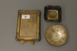 A small silver easel photograph frame,