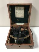 A ship's sextant by Husun in a fitted mahogany box