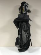 A golf bag containing King Cobra clubs