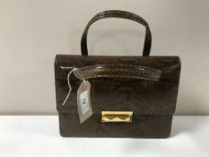 A vintage snakeskin hand bag and purse