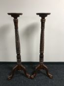 A pair of Georgian style mahogany torcheres