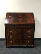 An inlaid mahogany fitted writing bureau