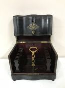 A Victorian ebonised decanter box with brass inlay