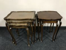 A nest of three walnut tables and nest of two tables