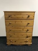 A pine five drawer chest