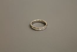 A heavy platinum diamond half eternity ring, approximately 0.7ct, size M/N.