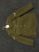 A part rail of eleven army dress jackets and six pairs of dress trousers