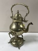 A brass spirit kettle on stand with burner together with a pair of impressive brass candlesticks,
