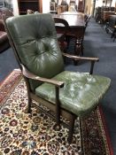 A mid 20th century armchair in green fabric