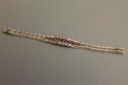 A fine quality ruby and diamond bracelet in 18ct white gold, 52g.