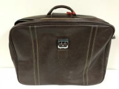 A vintage leather case and two 1980's Samsonite cases