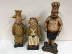 A fibre glass figure of a chef and two of pigs (3)