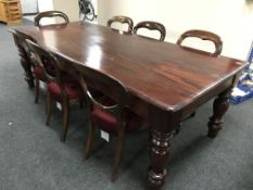 A Victorian style mahogany dining table and seven chairs