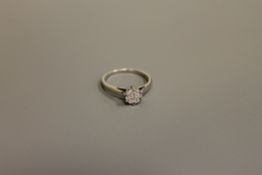 An 18ct white gold diamond cluster ring,