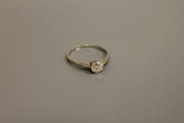 An 18ct white gold diamond solitaire ring, approximately .5ct, size N/O.