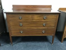 A late Victorian inlaid mahogany four drawer chest