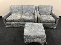 A five piece lounge suite upholstered in floral fabric