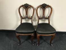 A pair of carved mahogany dining chairs