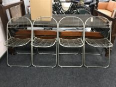 Four folding metal kitchen chairs