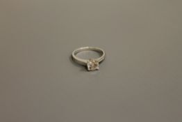 A platinum diamond solitaire ring, approximately 0.72ct, size H.