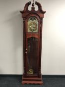 A Heritage longcase clock with brass dial