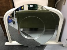 An un-framed mirror and a cream framed over mantel mirror