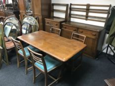 A seven piece 20th century oak dining room suite