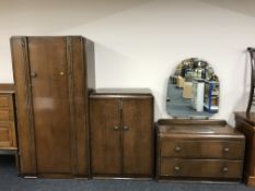 A three piece mid 20th century oak bedroom suite