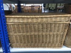 A large wicker laundry hamper