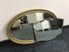 An oval gilt framed bevelled mirror together with a frameless mirror
