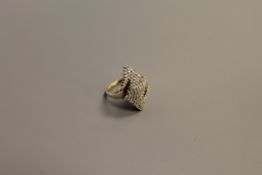 A diamond cluster ring, upon a yellow gold shank,