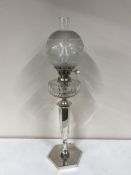 A good quality silver plated Evered & Co oil lamp with glass chimney and shade