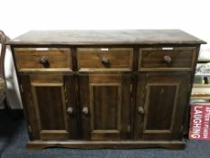 A pine triple door sideboard
