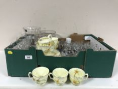 A box of part Crown Staffordshire tea service, lead crystal wine glasses, vases,