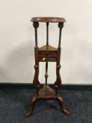 A reproduction mahogany wig stand