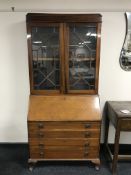 A mahogany bureau bookcase