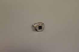 A sapphire and diamond ring in platinum setting,