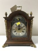 A reproduction continental Warmink mantel clock with gilt metal feet