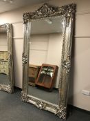 A large silvered bevelled mirror