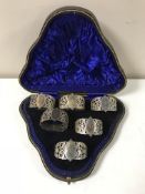 A set of six cased silver napkin rings, Sheffield marks, 1900.