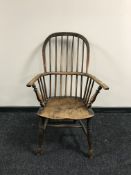 An antique elm Windsor style armchair