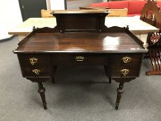 A continental oak desk on turned legs