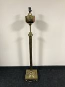A brass rise and fall standard lamp