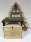 A pine three drawer storage chest, pine wall rack, teak garden occasional table,