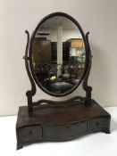 An antique mahogany dressing table mirror on stand