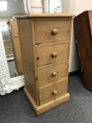 A narrow pine four drawer chest CONDITION REPORT: 43cm wide,
